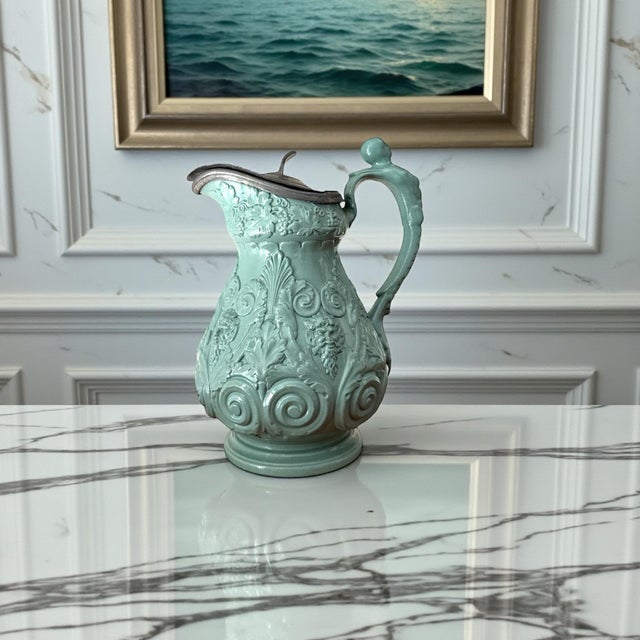 A rare-color example of an antique Ridgway relief-molded pitcher (Staffordshire, c. 1845–1860), finished in an...