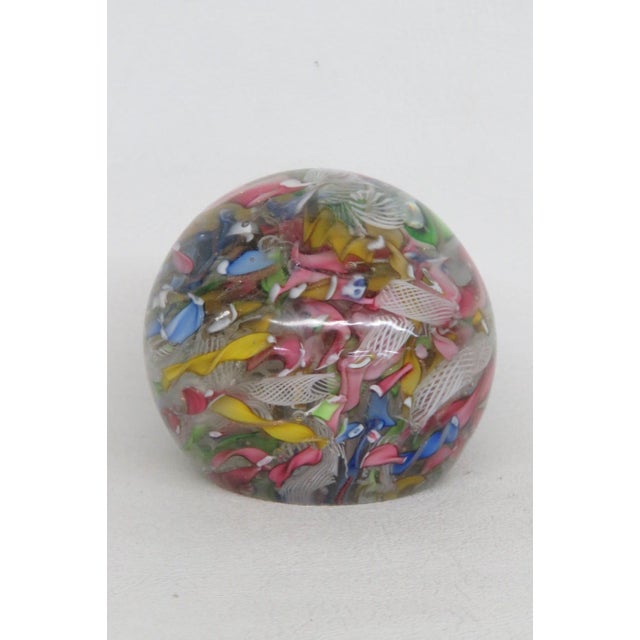 This gorgeous Paper Weight is made of art glass. This stunning vintage piece features a scrambled ribbon design enclosed...
