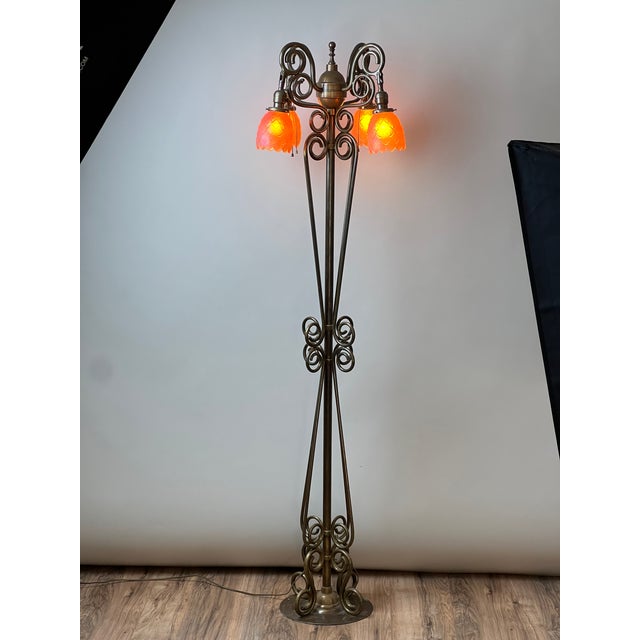 An exceptional French Art Nouveau brass floor lamp attributed to Jules Cayette and Charles Schneider, circa 1920. This...