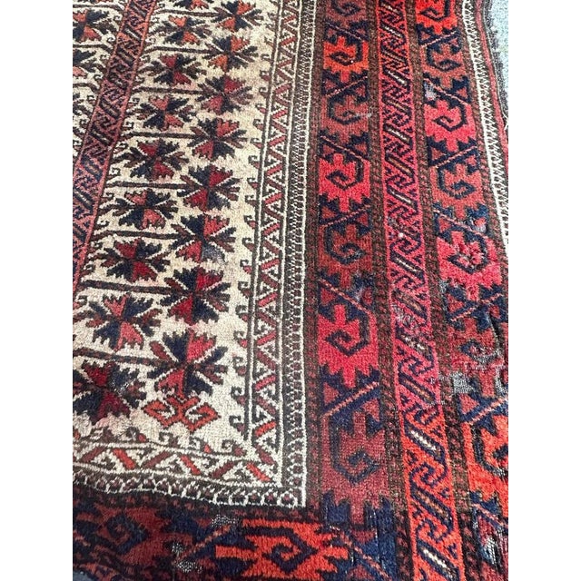 Pretty distressed antique Baluch rug with nice geometrical and tribal design, entirely and finely hand knotted with wool...