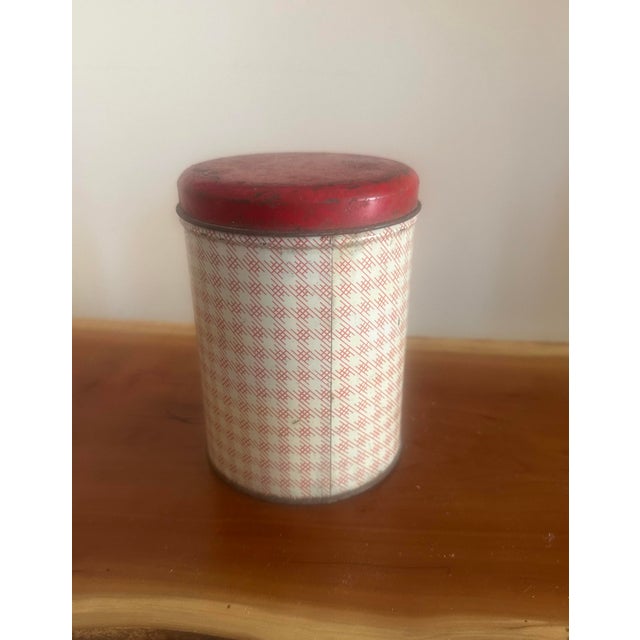 Classic vintage salt canister featuring a charming crosshatch pattern and bold “SALT” lettering. The red lid adds a warm...