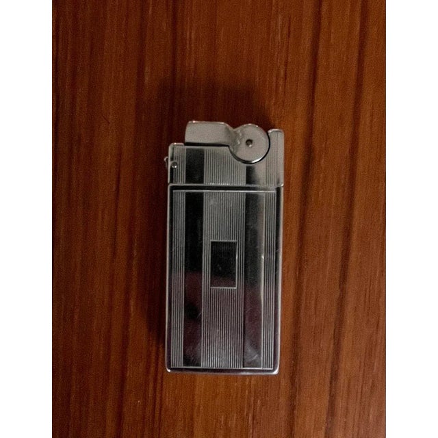 Vintage mid century modern chrome pocket lighter made by A.S.R Ascot in the United States. The "Rhodium" lighter (model...