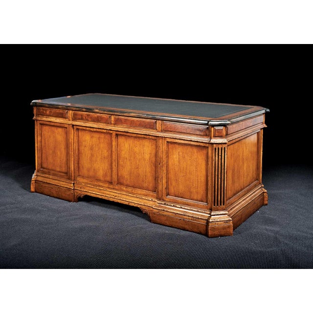 Handcrafted in Italy from solid walnut, this executive desk combines traditional design with practical functionality. The...