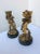 Great pair of figural bronze match holders. Each one is mounted on a round marble base and each figure carries a basket to...