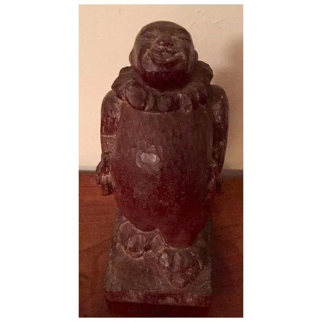 French Art Deco carved wood sculpture of a clown or jester. Wonderfully stylized with pleasing patina. The surface...