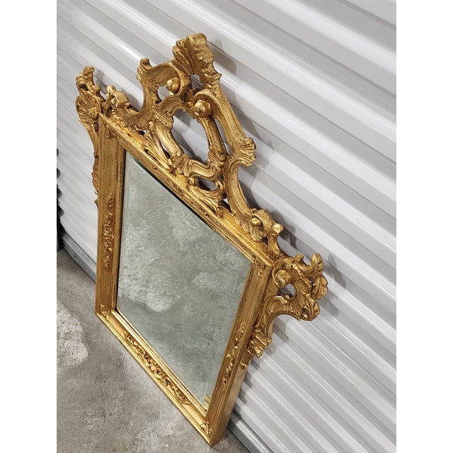 Vintage Italian Rococo Style carved giltwood mirror by Labarge mirrors company. The top crown and sides are heavily...