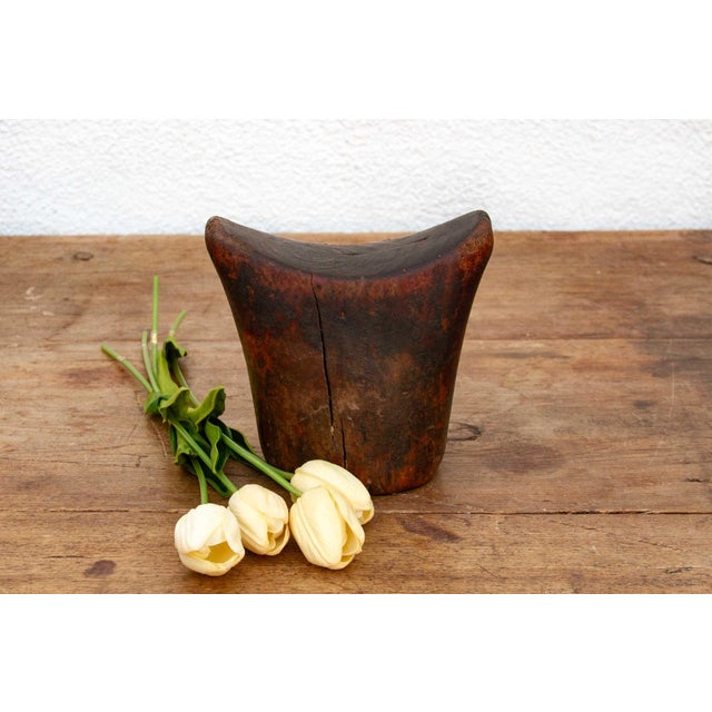 This antique Sidama headrest is more than just a piece of wood; it's a testament to the artistry and traditions of...