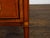 A pair of Italian Neoclassical style walnut bedside tables from circa 1800 with two drawers and marquetry décor. This pair...