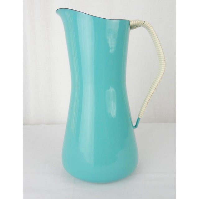1950s Kobenstyle Teal Enamel Pitcher with Cord Wrapped Handle as designed by Jens Quistgaard for Dansk. Base is hallmarked...