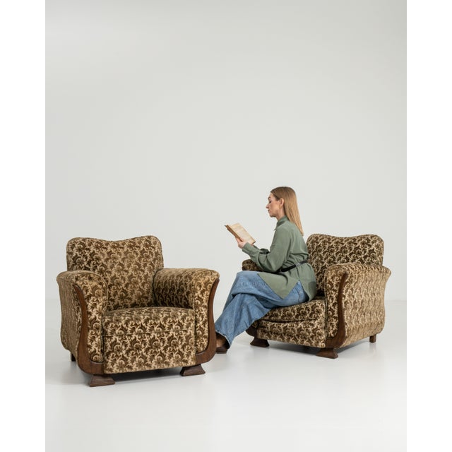 A sophisticated pair of Art Deco armchairs featuring geometric forms and balanced proportions. The design reflects the...