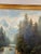 This painting is a 19th-century oil on canvas landscape featuring a dramatic waterfall cascading down a rocky...