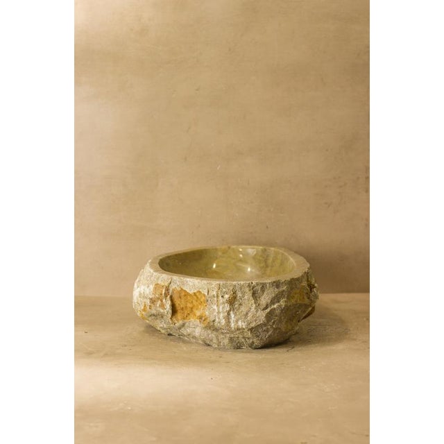 A raw-edge wash basin carved from a single piece of natural onyx, millions of years in the making. Handcarved and polished...