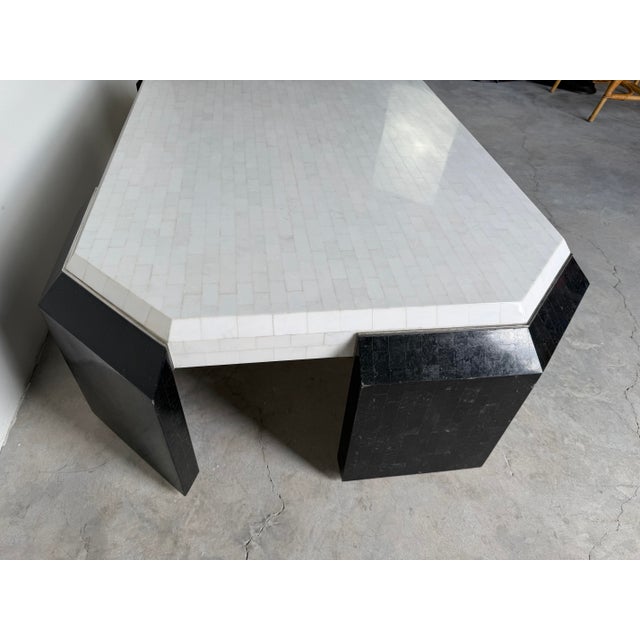 Striking 1980’s postmodern coffee table crafted in tessellated stone, featuring a bold geometric design with a white stone...