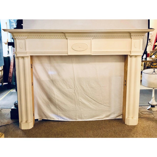 A monumental custom quality solid wood hand carved neoclassical fire place surrounds. This is a simply stunning piece in...