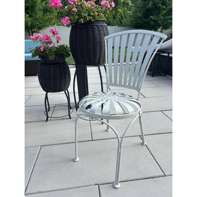 Offered is a single vintage sunburst pinwheel petite garden chair by Francois Carre. This iconic chair has been...
