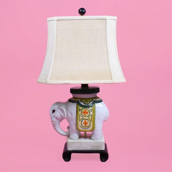 An Italian ceramic elephant table lamp, the elephant base hand-modeled and full of character beneath a classic shade line....