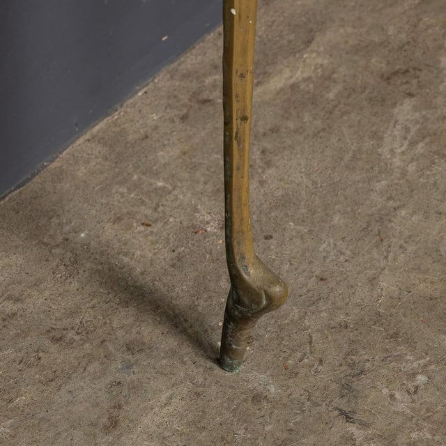 Mid 20th Century Italian console with a brass frame and marble inset top, paired with a matching brass framed mirror. A...