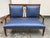Design Plus Gallery presents an Antique Edwardian Settee. A mahogany settee with decorative banded inlay, a pierced...