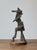 Vintage metal brutalist sculpture on round wood base. Great patina to the metal. The metal piece of this decorative...