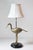 This 20th-century French lamp is a charming example of functional artistry, blending naturalistic and decorative elements....