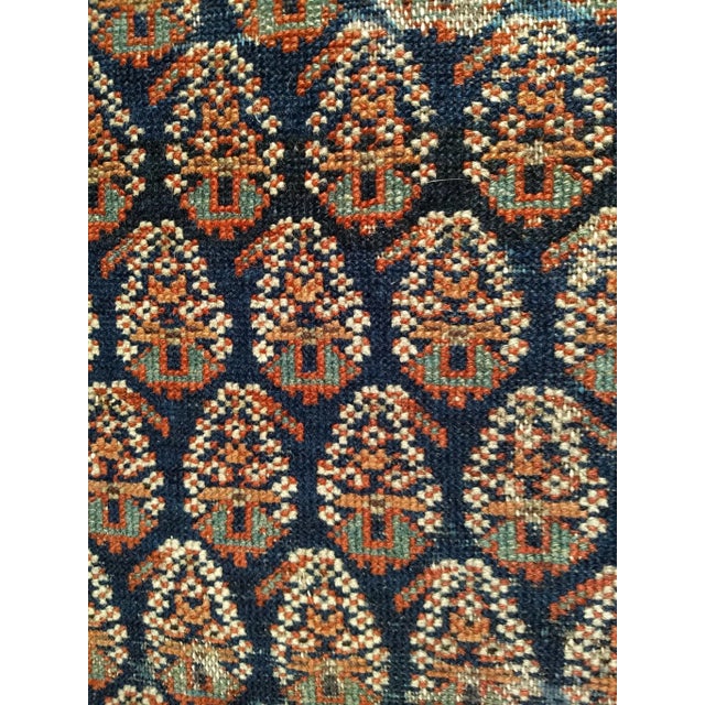 This elegant early 20th century Persian Malayer area rug features a striking allover paisley motif, a design prized for...