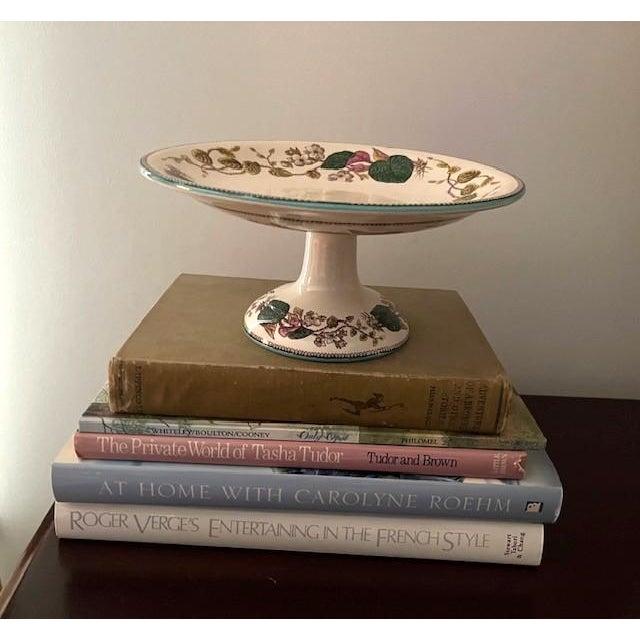 Beautiful Wedgwood comport decorated with garlands of blossoms, various leaves, and vines with a decorative edging, all on...