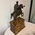A Grand Tour Bronze Equestrian Model of Marcus Aurelius After the Antique, Late 19th Century mounted to a painted wood...