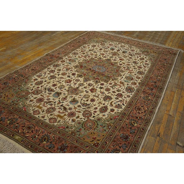A mid-20th-century Tabriz carpet with silk highlights, The piece measures approximately 5’11” × 9’6″ (180 × 290 cm). Silk-...