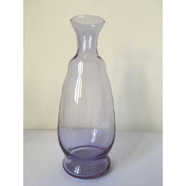 This is a charming and elegant piece hand made in Murano, Venice, Italy in 1960. The blown glass has a vibrant color, the...