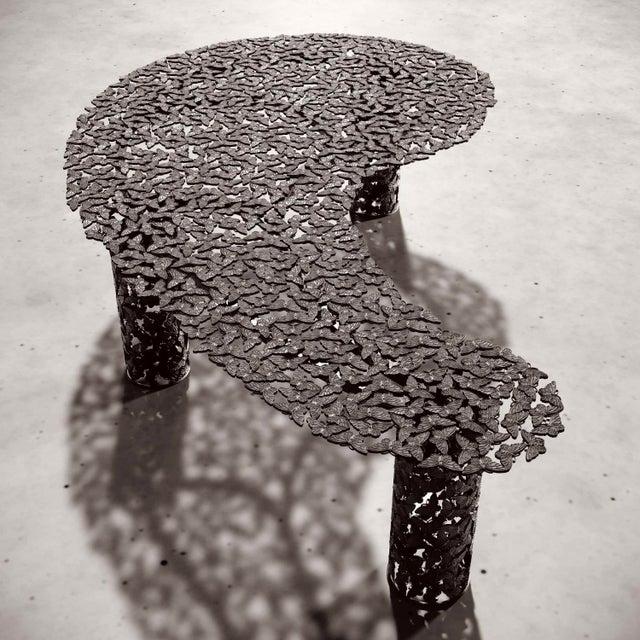 A kaleidoscope of butterflies takes shape in patinated bronze, captured mid-flight by Italian artisans using the ancient...