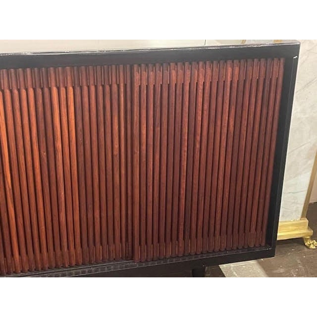 The Vintage Italian Walnut and Ebony Sideboard is a luxurious and elegant piece of furniture. Made from high-quality...