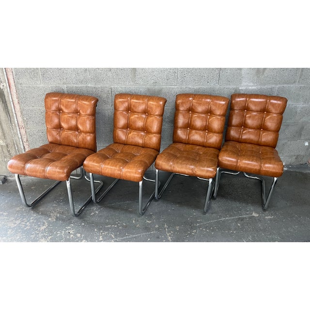 Set of Four Vintage Mid-Century Modern Chrome Canteliever Dining Chairs in the Milo Baughman Style. Circa 1970s. Feature a...