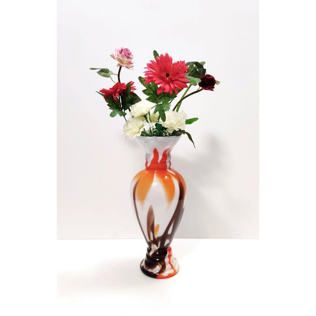 Made in Italy, 1970s. This vase is made in Murano glass. It might show slight traces of use since it's vintage, but it can...