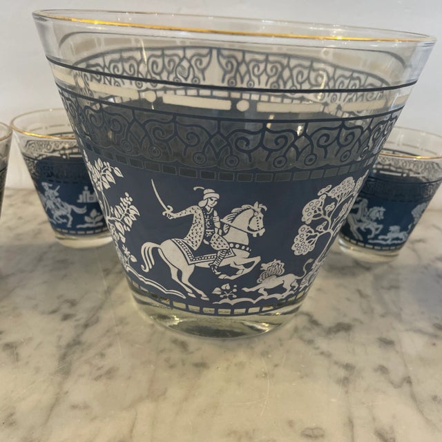 Fantastic set of Wedgwood-Blue Jasper-Ware bowl with 6 small tapered matching glasses. The applied blue design represents...