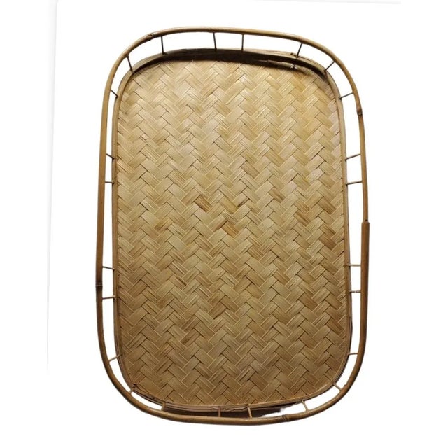 Vintage rectangular bamboo tray. Nice woven detailing with a bamboo rail, rounded corners, lightweight and lovely. This...
