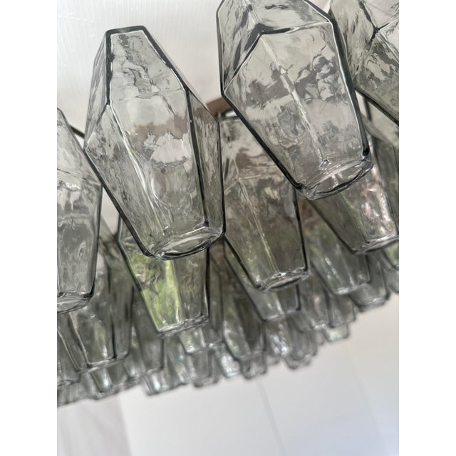 Contemporary and luxury flush mount with gray “POLIEDRI” Murano glass in Venini style. Glass elements are blown inside a...