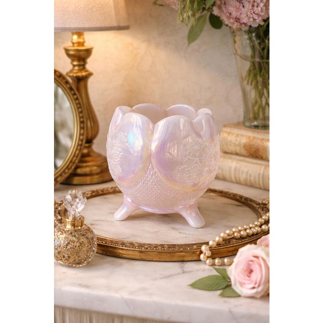 This vintage Fenton pale pink carnival glass rose bowl features a luminous opalescent finish with soft pastel iridescence...