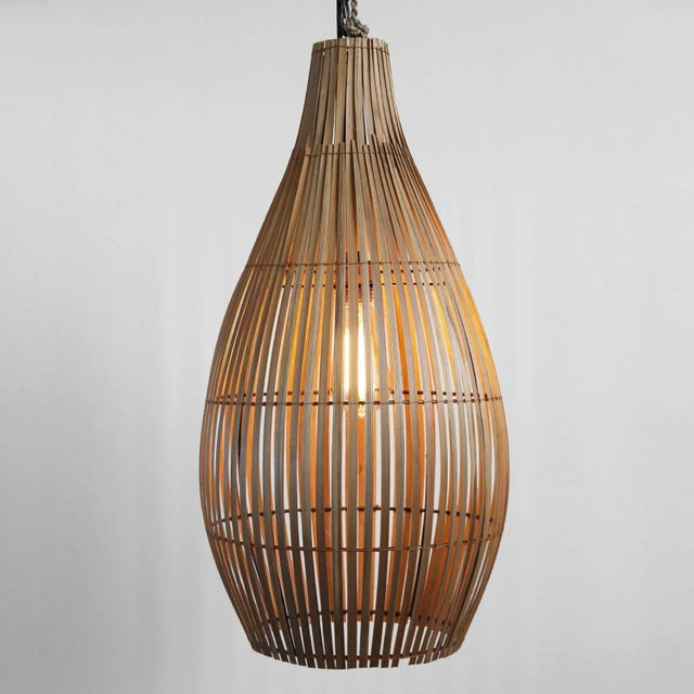 Handmade raw organic bamboo strip bottle shaped hanging lantern. Each slightly unique in natural detail and finish....