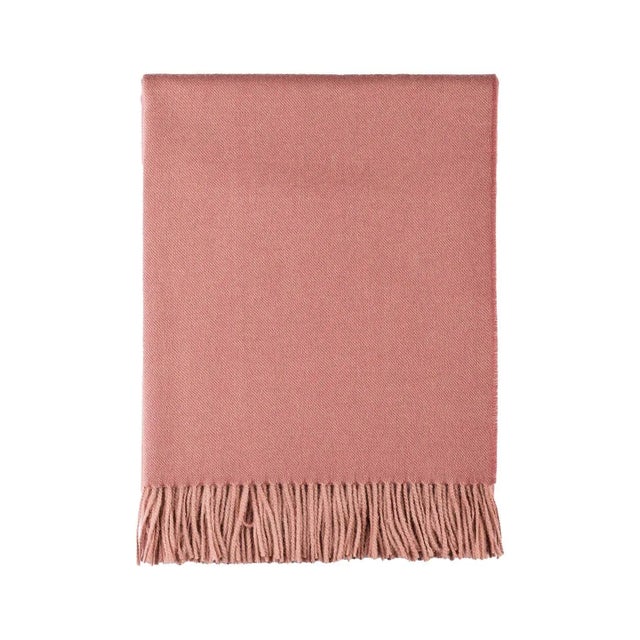 A 100% alpaca wool throw blanket in a rich and invigorating shade of persimmon. Woven from 100% baby alpaca, the most...