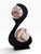 Striking vintage 1970s sculptural table lamp featuring a dramatic black S-form silhouette supporting two spherical shades....
