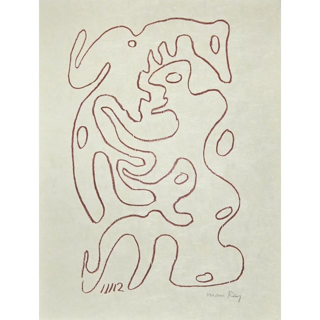 The Absolute Real is a lithograph realized by Man Ray in 1964. Hand-singed in pencil by the Artist. Lithograph in Red Ink,...