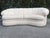 A 1980s vintage asymmetric curved sofa by Thayer Coggin. The sofa is back-channelled and is lower on the left end as you...