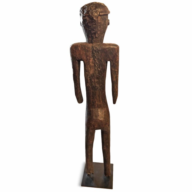 Antique Hemba ancestral figure from the Democratic Republic of Congo. Hand-carved from a single piece of wood with rare...