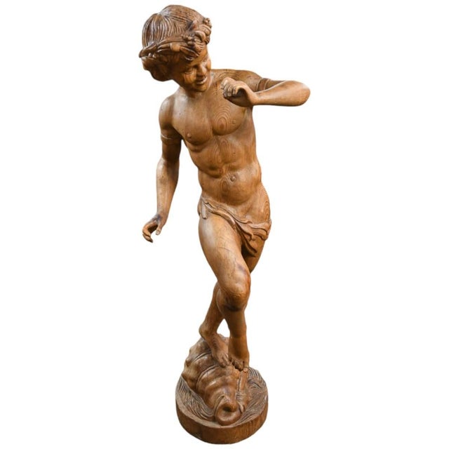This large fruitwood carved figure depicts Pan, the ancient Greek god of nature, shepherds, and the wild, rendered here in...