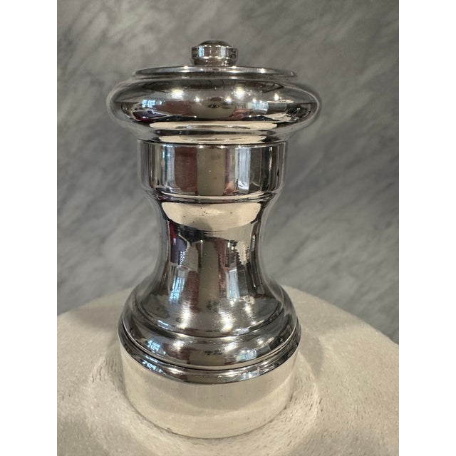 Elevate every meal with this exquisite sterling silver pepper mill, a piece that transcends function to become a genuine...