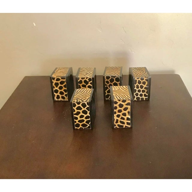 These African inspired carved napkin rings are a great addition to a wildlife table setting. Two sides carved in zebra,...
