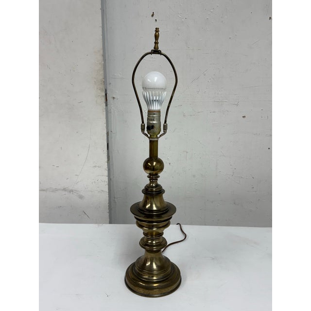 Design Plus Gallery presents a Late 20th Century Brass Table Lamp from Stiffel. The lamp showcases a turned brass body...