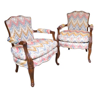 Pair of Mid-Century French Louis XV Style Walnut Bergère Fauteuils With Ikat Upholstery For Sale
