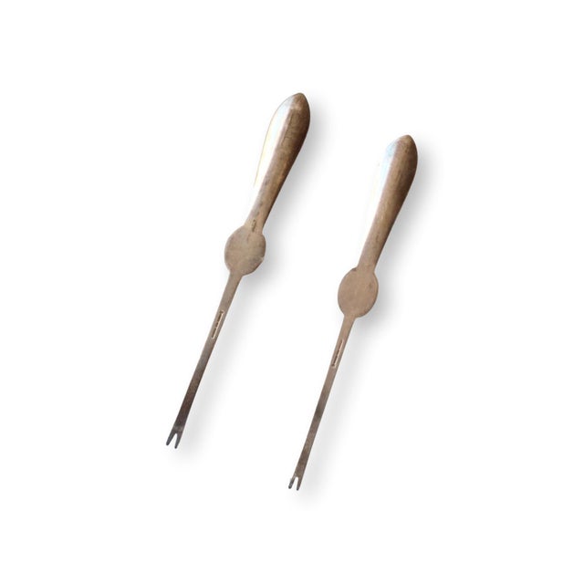 Pair of antique English hotelware lobster picks marked for the Stork Hotel and dating to the 1920s. They feature stamped...