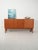 Scandinavian teak sideboard from the 1960s with two doors and drawers on the right, recessed handles, and square legs....